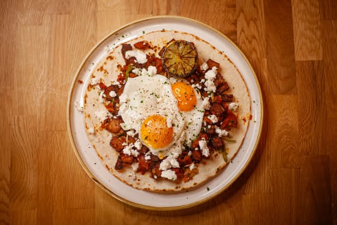 Huevos Rarebit Hock with ham hock, cider rarebit and runny eggs