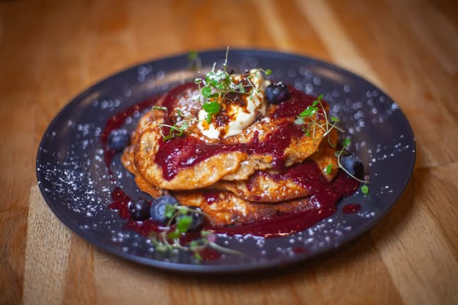 Berry pancake stack with compote and crème fraîche